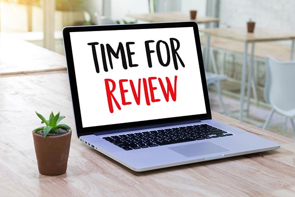 Time for reviews text on the laptop screen